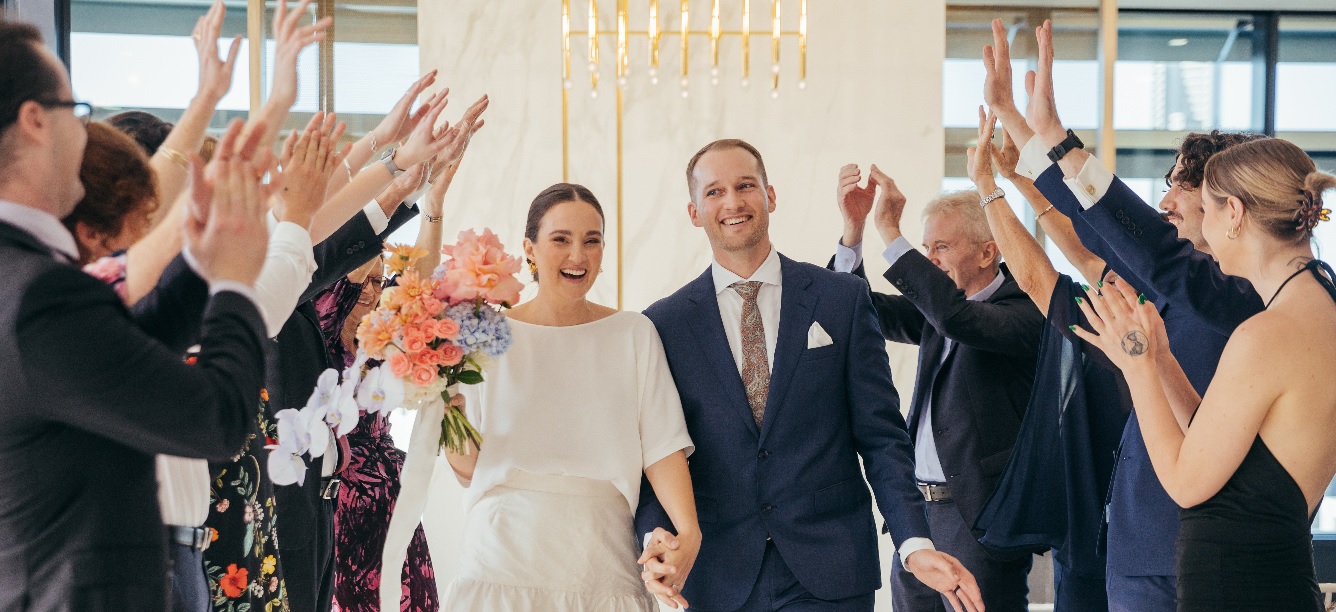 Guests celebrating married couple